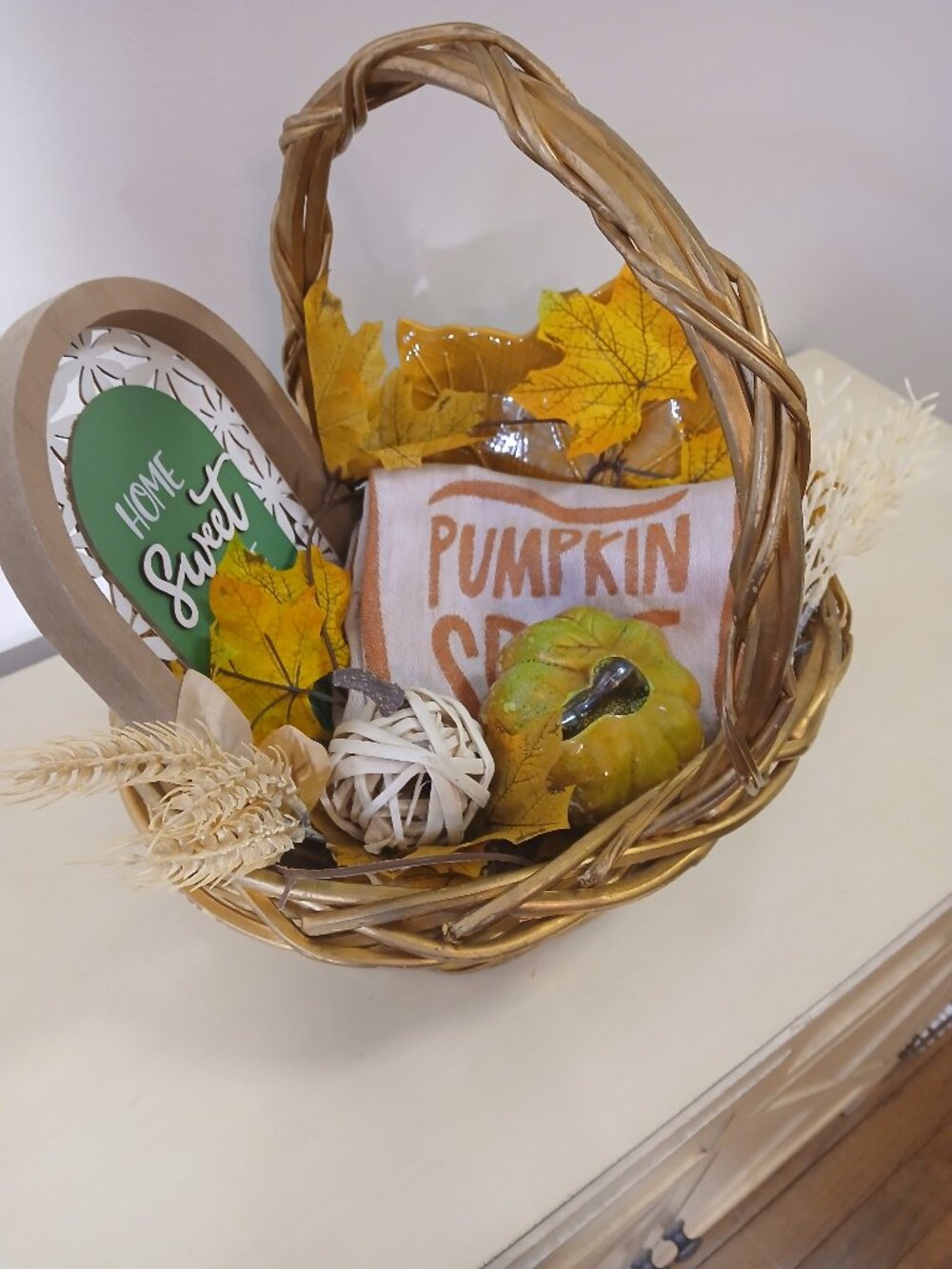 Wicker basket with fall decor with 5 items